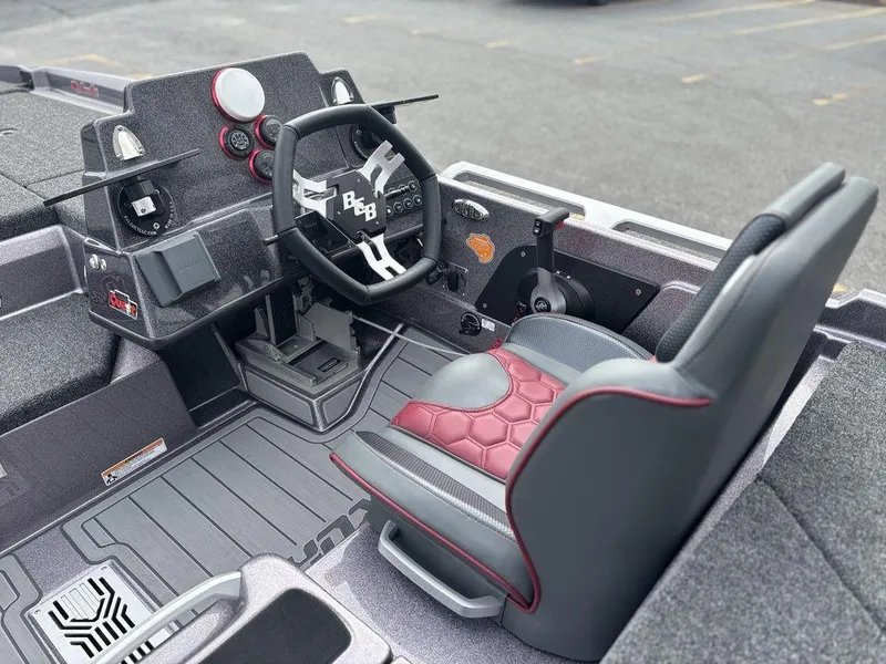 Slide: The Image of 2026 Bass Cat Lynx STS boat interior with modern steering and seating design. - 11