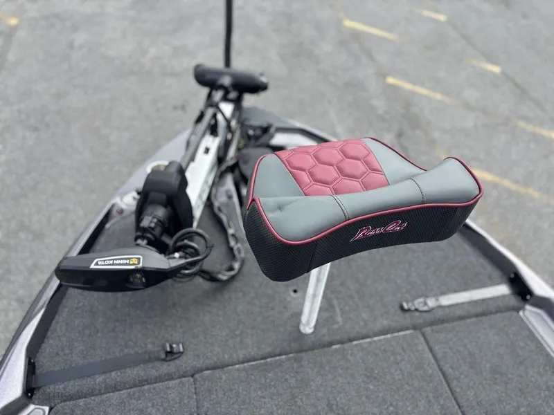 Slide: The Image of 2026 Bass Cat Lynx STS boat seat and trolling motor on deck. - 15