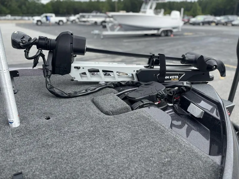 Slide: The Image of 2026 Bass Cat Lynx STS boat with Minn Kota Ultrex trolling motor on deck. - 24