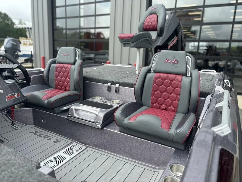 Slide: The Image of 2026 Bass Cat Lynx STS boat interior with red and gray seating, showcasing modern design. - 9