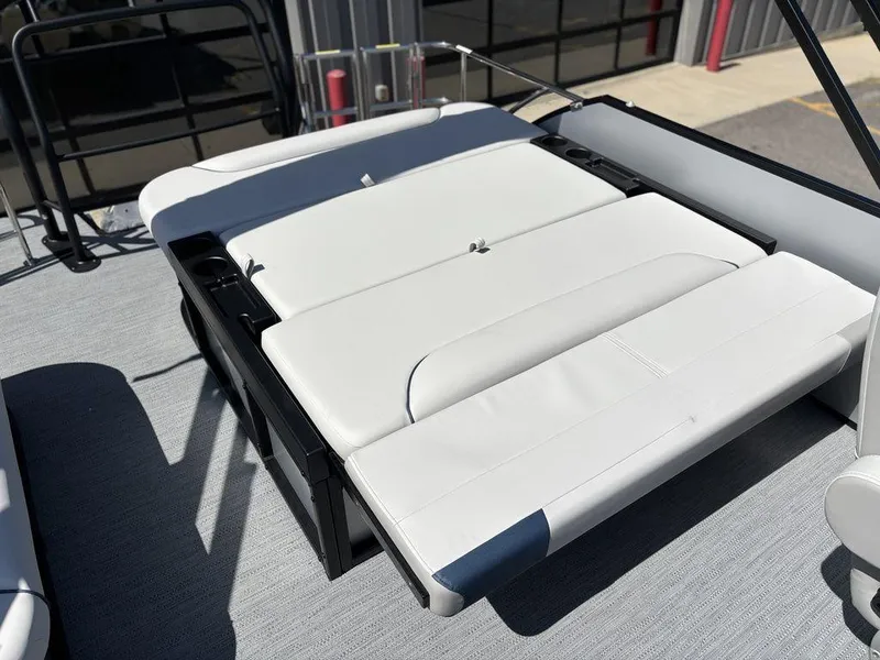 Slide: The Image of 2026 Godfrey SWEETWATER 2286 SFL boat with white cushioned seating and cup holders. - 22