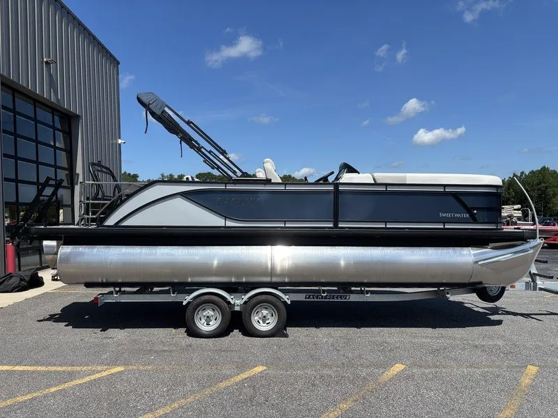 Slide: The Image of 2026 Godfrey SWEETWATER 2286 SFL pontoon boat on trailer, parked outdoors. - 3