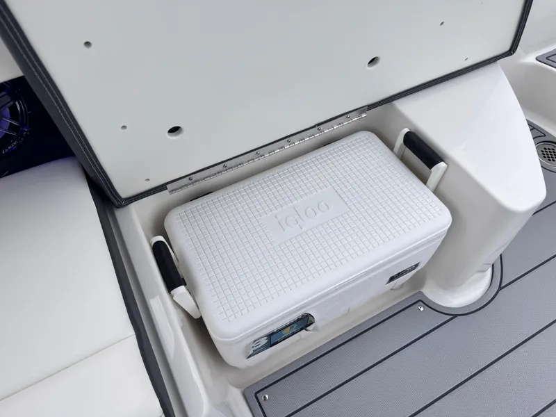 Slide: The Image of 2025 Chaparral 307 SSX boat with Igloo cooler storage compartment. - 17