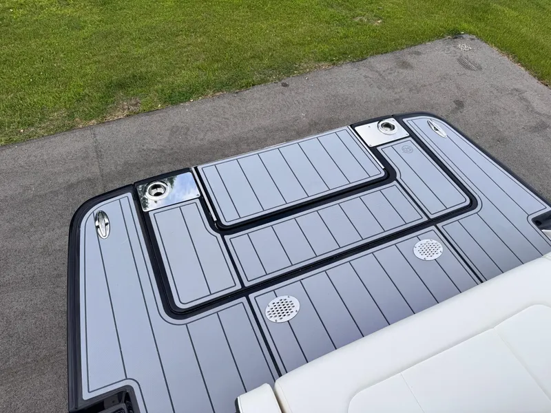 Slide: The Image of 2025 Chaparral 307 SSX boat deck with sleek design and integrated speakers. - 20