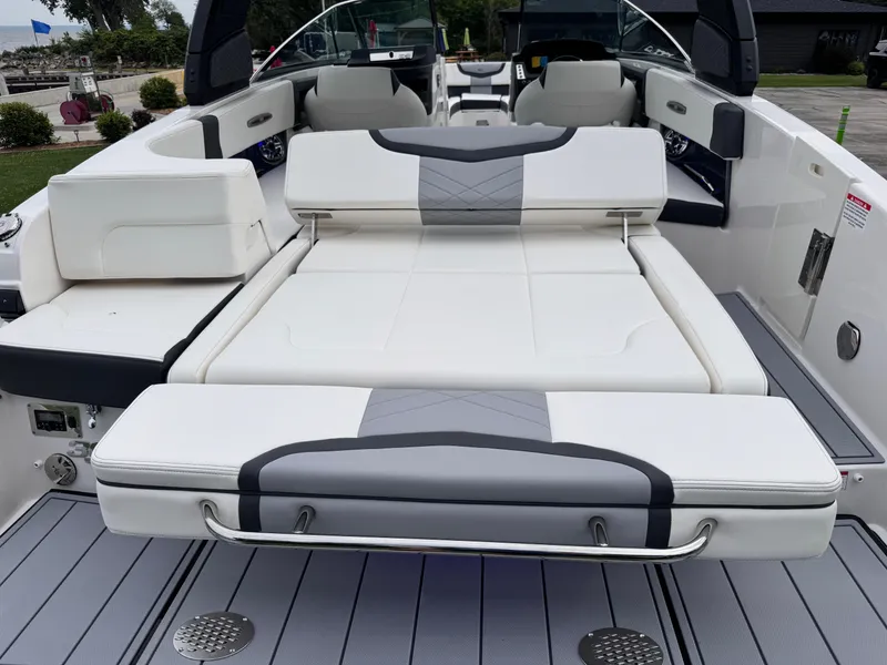 Slide: The Image of 2025 Chaparral 307 SSX boat with luxurious white seating and sleek design. - 22