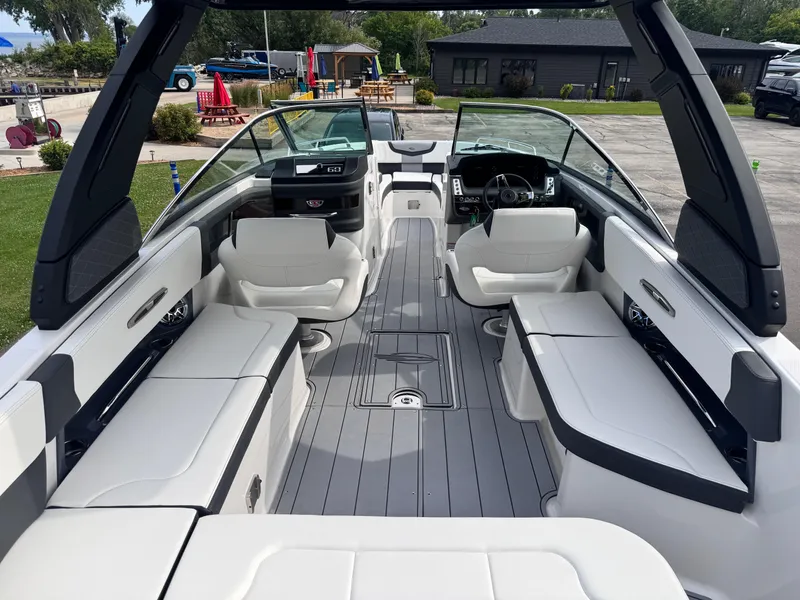 Slide: The Image of 2025 Chaparral 307 SSX boat interior with sleek seating and modern design. - 24