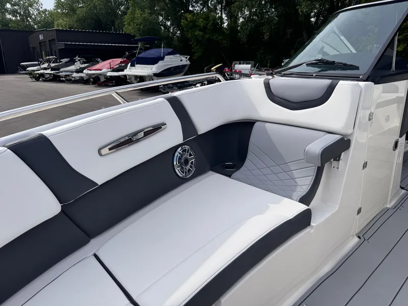 Slide: The Image of 2025 Chaparral 307 SSX boat interior with sleek seating and modern design. - 31