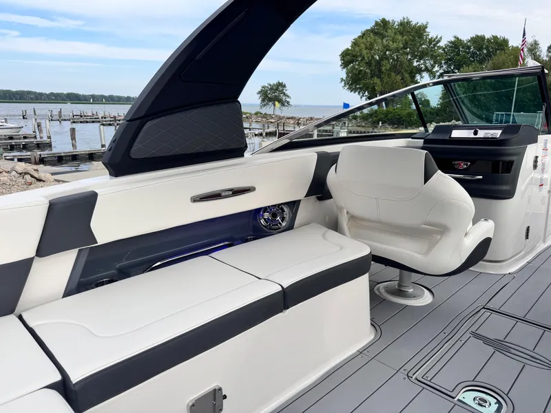 Slide: The Image of 2025 Chaparral 307 SSX boat interior with sleek seating and modern design. - 7