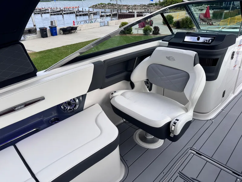 Slide: The Image of 2025 Chaparral 307 SSX boat interior with luxurious seating and waterfront view. - 8
