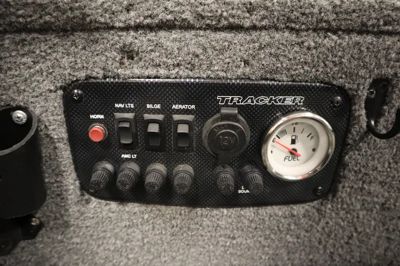 Slide: The Image of Control panel of 2018 Tracker Panfish 16 boat with switches and fuel gauge. - 17
