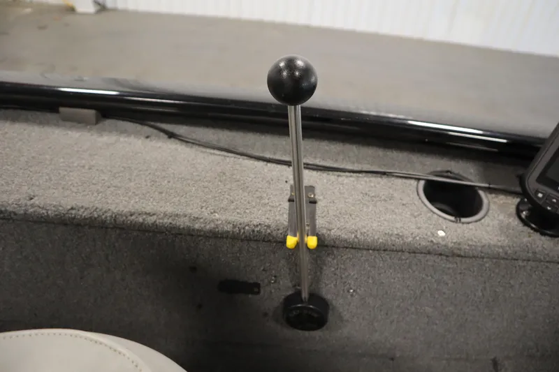 Slide: The Image of 2018 Tracker Panfish 16 boat interior with gear lever and control panel. - 22