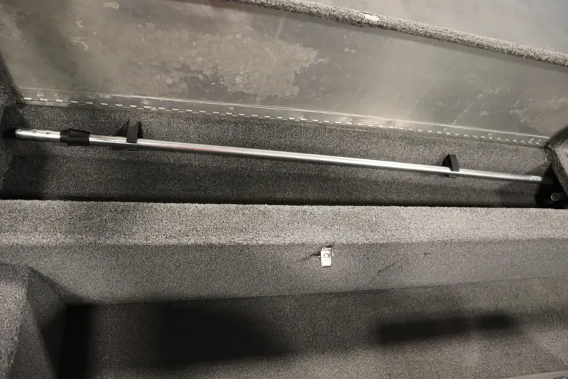 Slide: The Image of 2018 Tracker Panfish 16 storage compartment with rod holder. - 26