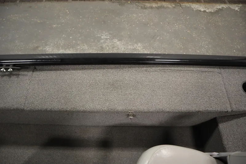 Slide: The Image of 2018 Tracker Panfish 16 boat interior with gray carpet and seating. - 27