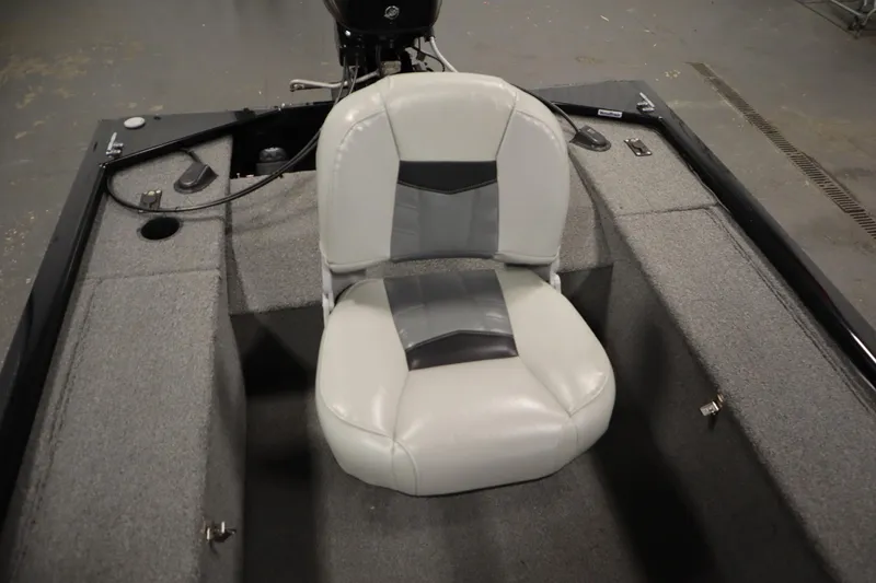 Slide: The Image of 2018 Tracker Panfish 16 boat interior with gray seating and carpeted flooring. - 29