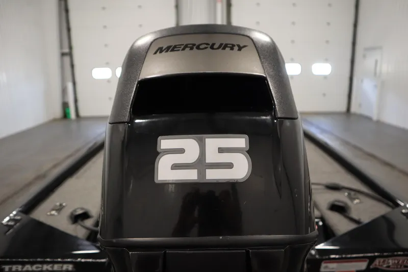 Slide: The Image of 2018 Tracker Panfish 16 with Mercury 25 horsepower engine in a garage. - 32