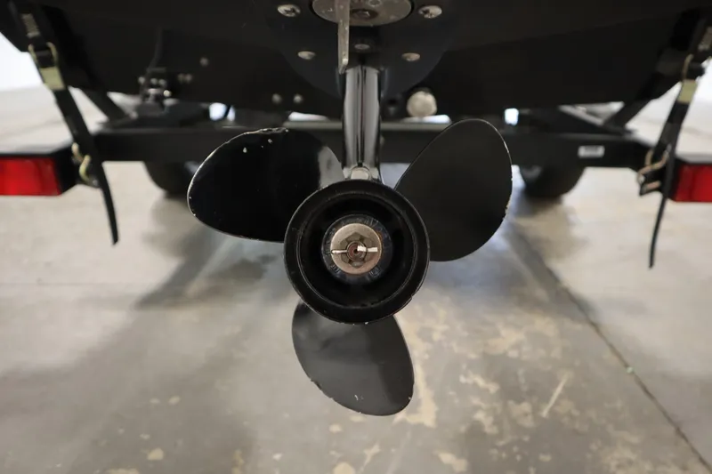 Slide: The Image of 2018 Tracker Panfish 16 boat propeller close-up in a garage setting. - 34