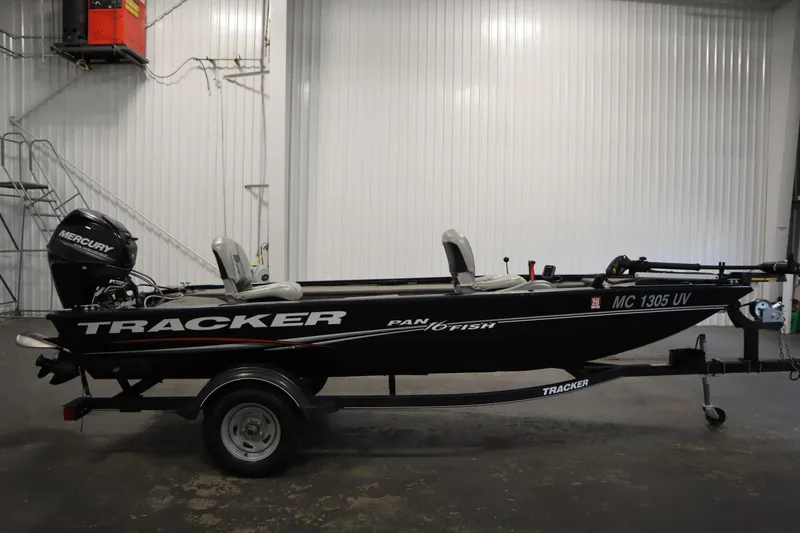 Slide: The Image of 2018 Tracker Panfish 16 boat with Mercury engine in a garage setting. - 4