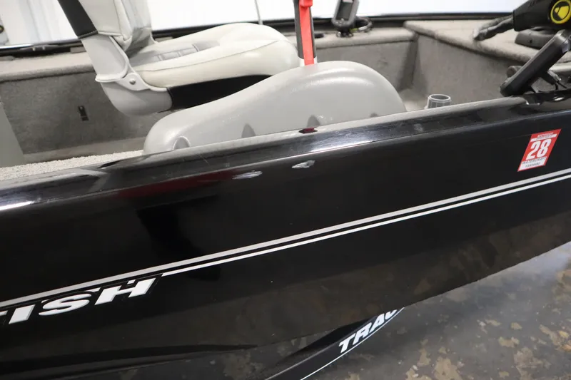 Slide: The Image of 2018 Tracker Panfish 16 boat interior with seating and registration sticker. - 40