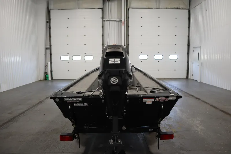 Slide: The Image of 2018 Tracker Panfish 16 boat with Mercury 25 engine in a garage setting. - 6