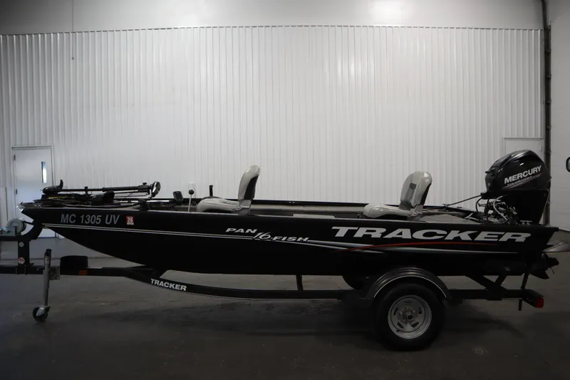 Slide: The Image of 2018 Tracker Panfish 16 boat with Mercury engine in a garage setting. - 8