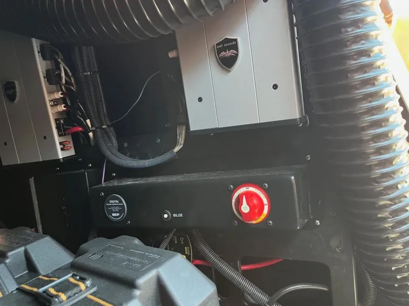 Slide: The Image of Engine compartment of a 2021 Supreme S 238 boat with wiring and control panel. - 13