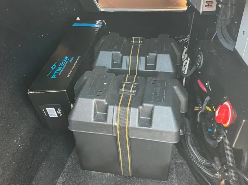 Slide: The Image of Battery compartment of a 2021 Supreme s 238 boat with wiring and components. - 14