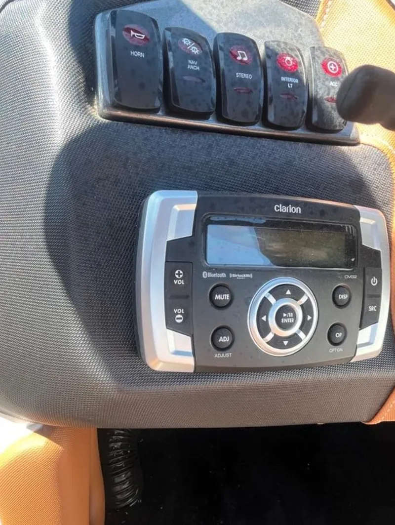 Slide: The Image of Control panel and Clarion stereo system in 2021 Supreme S 238 boat. - 18