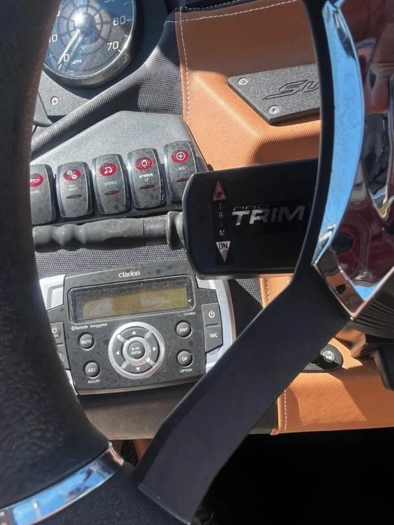 Slide: The Image of Dashboard of a 2021 Supreme S 238 boat with controls and Clarion stereo. - 21