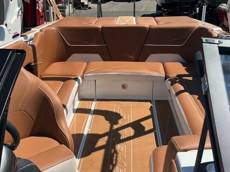 Slide: The Image of 2021 Supreme S 238 boat interior with tan leather seating and sleek design. - 28