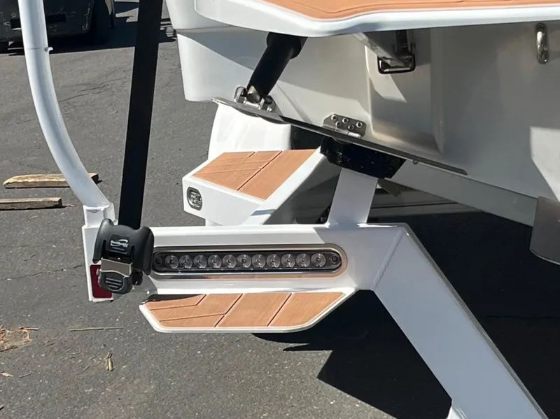 Slide: The Image of 2021 Supreme S 238 boat rear view with teak accents and LED lights. - 4