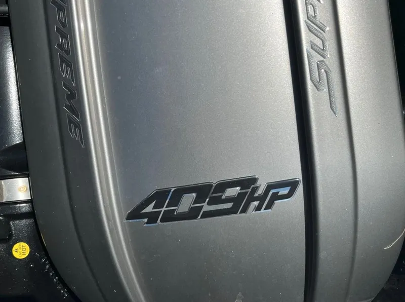 Slide: The Image of Supreme S 238 engine cover with 409 horsepower label, 2021 model. - 8
