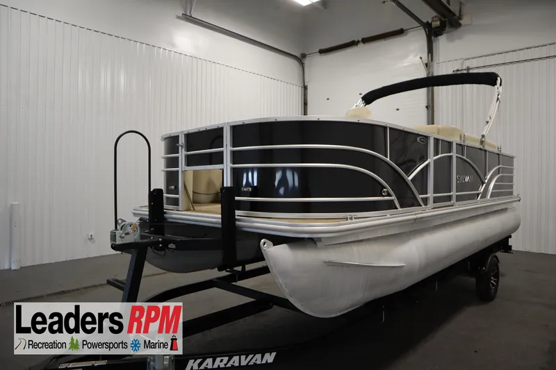 Slide: The Image of 2019 Sylvan 820 Mirage pontoon boat on trailer in indoor storage. - 2