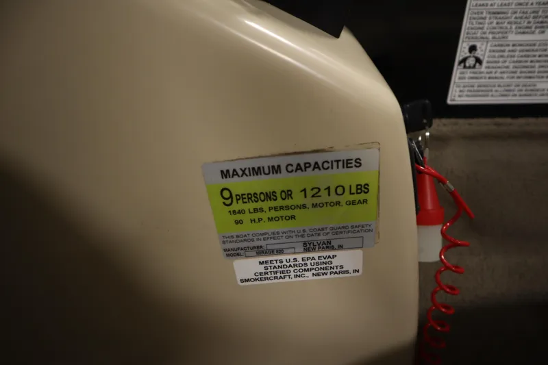 Slide: The Image of Capacity label on 2019 Sylvan 820 Mirage boat, max 9 persons or 1210 lbs. - 25