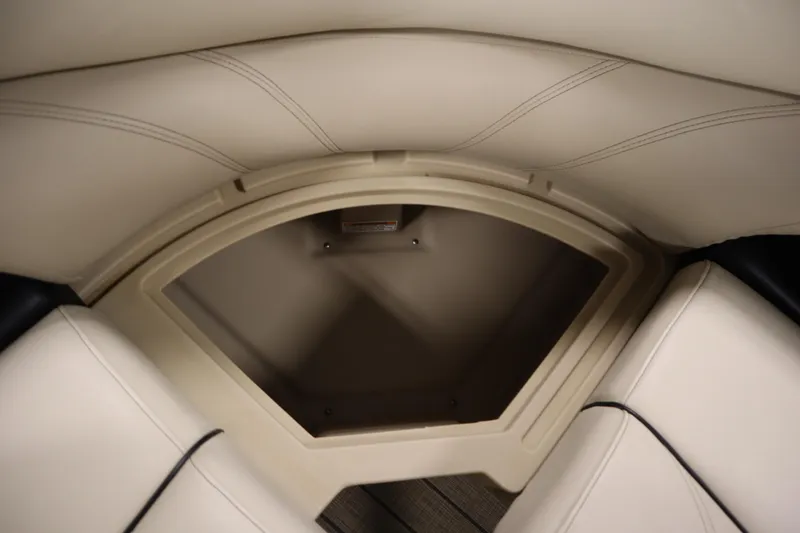 Slide: The Image of 2019 Sylvan 820 Mirage boat interior storage compartment with beige upholstery. - 31