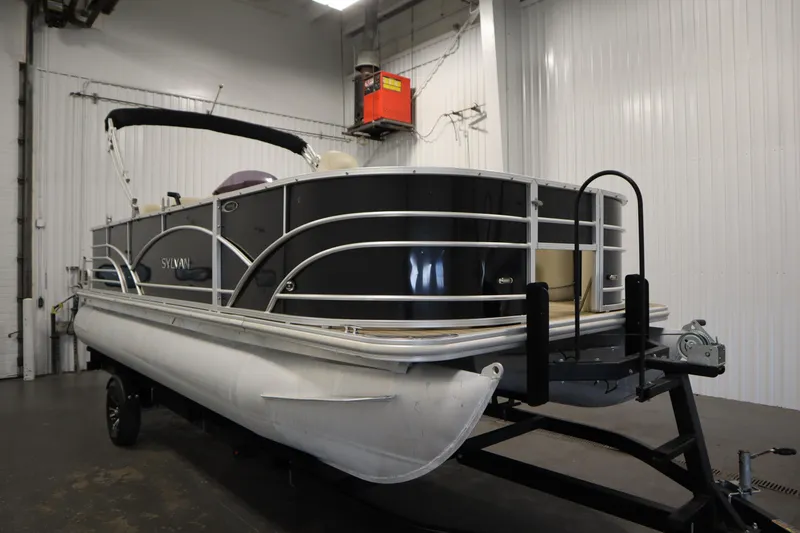 Slide: The Image of 2019 Sylvan 820 Mirage pontoon boat in indoor storage on trailer. - 4