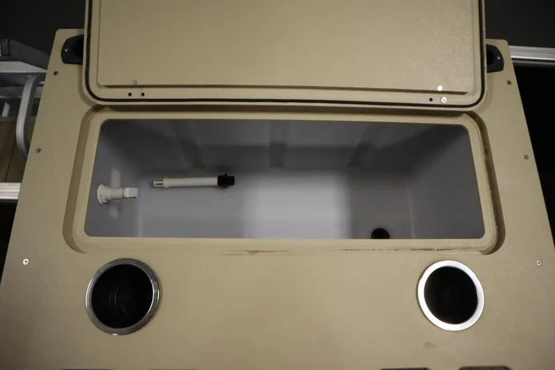 Slide: The Image of Open storage compartment on 2019 Sylvan 820 Mirage boat, featuring cup holders. - 40