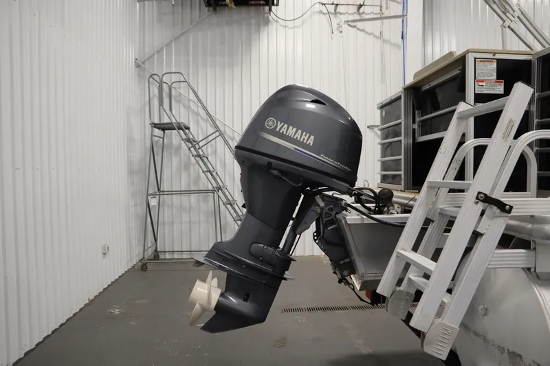 Slide: The Image of 2019 Sylvan 820 Mirage with Yamaha outboard motor in a storage facility. - 44