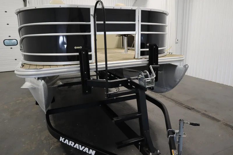 Slide: The Image of 2019 Sylvan 820 Mirage pontoon boat on Karavan trailer in indoor storage. - 46