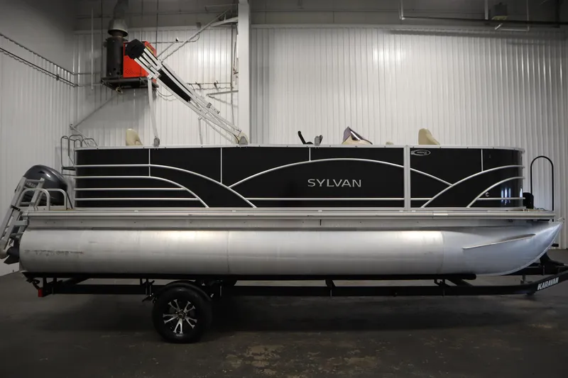 Slide: The Image of 2019 Sylvan 820 Mirage pontoon boat in a showroom, side view. - 5