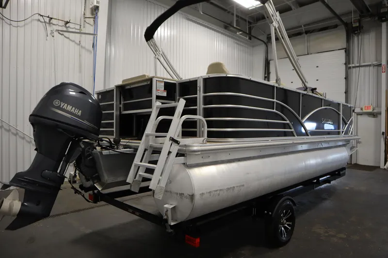Slide: The Image of 2019 Sylvan 820 Mirage pontoon boat with Yamaha outboard motor in a garage. - 6