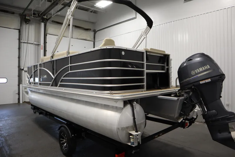 Slide: The Image of 2019 Sylvan 820 Mirage pontoon boat with Yamaha motor in indoor storage. - 8