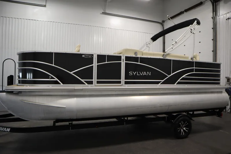 Slide: The Image of 2019 Sylvan 820 Mirage pontoon boat in a showroom setting. - 9