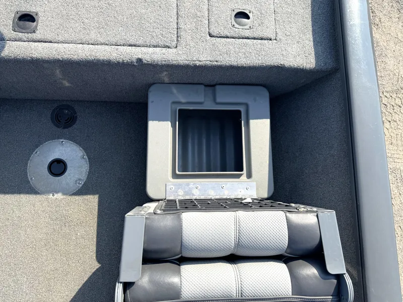 Slide: The Image of 2016 Tracker Pro Team 175 TF boat interior with storage compartment and seating. - 11