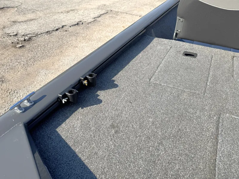 Slide: The Image of 2016 Tracker Pro Team 175 TF boat deck with carpet and rod holders. - 12