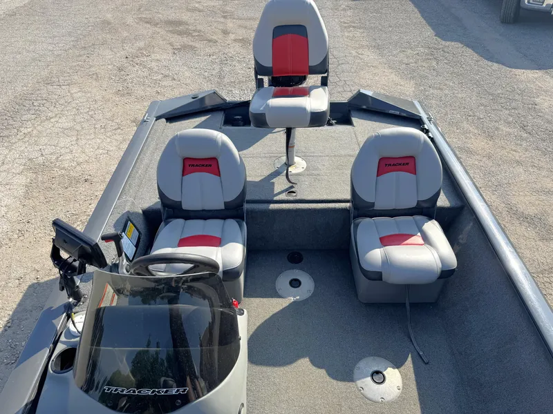 Slide: The Image of 2016 Tracker Pro Team 175 TF boat interior with three seats and steering console. - 16