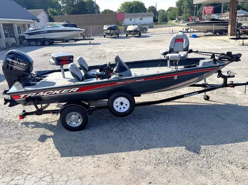 Slide: The Image of 2016 Tracker Pro Team 175 TF boat on trailer, parked outdoors. - 19
