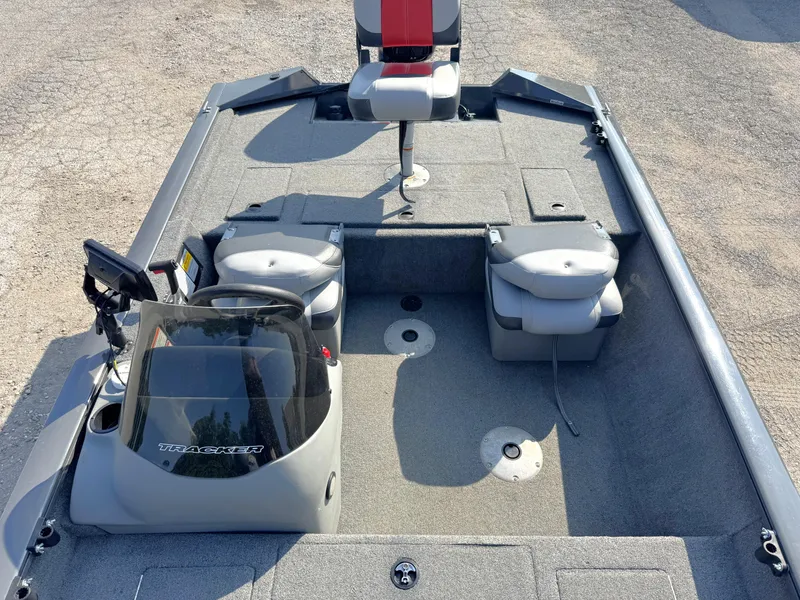 Slide: The Image of 2016 Tracker Pro Team 175 TF boat interior with seating and control panel. - 6