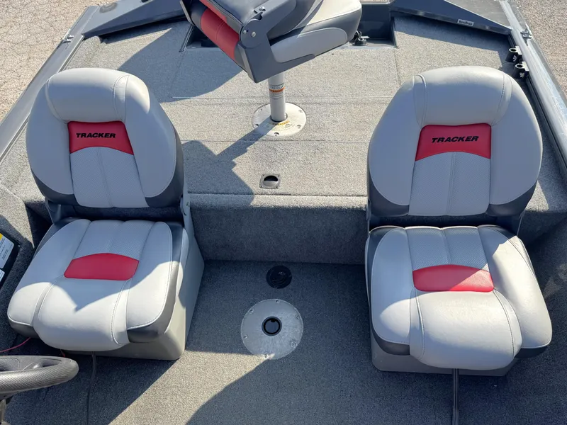 Slide: The Image of 2016 Tracker Pro Team 175 TF boat seats with red and gray upholstery. - 7