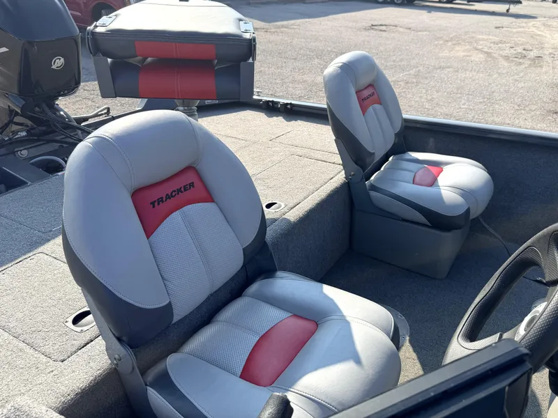 Slide: The Image of 2016 Tracker Pro Team 175 TF boat seats with red and gray upholstery. - 9