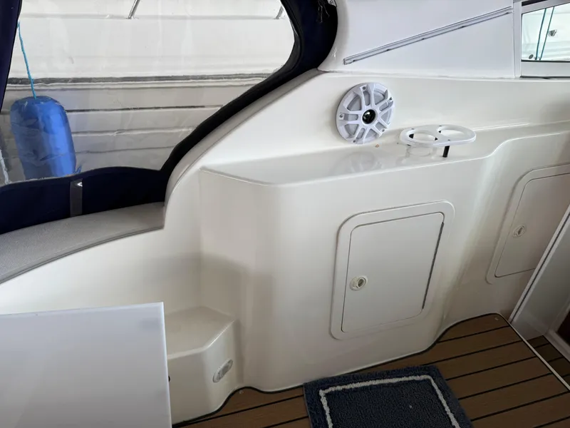 Slide: The Image of 2004 Cruisers Yachts 280 Express interior with speaker and storage compartments. - 28